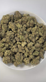 PUFFY LA Pop Rocks is an indica-dominant hybrid THCa strain, created from the potent pairing of Triangle Kush BX2 and Z Animal. The aroma delivers a sweet candy scent intertwined with pungent gas notes and a sharp, chemical undertone. Visually, the buds are long and pepper-shaped with a minty green hue, thick orange pistils, and a generous coating of bright white crystal trichomes. Consumers often report an initial energizing cerebral uplift that boosts mood and sparks creativity, followed by a smooth trans