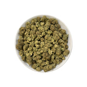 PUFFY Double Shot is a balanced hybrid THCa strain, born from the potent cross between London Pound Mintz and Jealousy. The aroma carries a bold mix of sweet apricot and tropical papaya layered with sharp, chemical undertones. Visually, the buds display deep green tones with hints of purple, bright orange hairs, and a frosty trichome coating. Consumers often report experiencing an uplifting head high that eases into deep physical relaxation and restful sleep.
