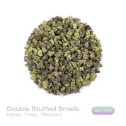 PUFFY Double Stuffed (smalls) is an indica-dominant  hybrid THCa strain, born from the unique pairing of Platinum White and Cookies and Cream. The aroma is a vibrant blend of citrus, funky undertones, and subtle chemical notes, creating a distinctive and memorable scent profile. Visually, dense green buds with hints of purple, bright orange pistils, and a thick coating of sparkling trichomes. Consumers often report a euphoric, uplifting head high that settles into calming physical relaxation, resulting in a