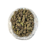 PUFFY Gelato 44 is an Indica-dominant hybrid THCa strain born from the flavorful cross of Sunset Sherbet and Thin Mint Girl Scout Cookies. The aroma delivers a rich fusion of earthy depth, creamy smoothness, and a bold gassy punch, offering a full-bodied sensory experience that mirrors its potent character. Visually, the buds are dense, frosty, and resin-coated, showcasing deep forest greens accented with purple hues and vivid orange pistils. Consumers often report an initial cerebral rush that feels uplift
