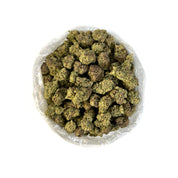 PUFFY Grape Gas THCa offers a distinctive aroma reminiscent of its name: sweet grapes and berries with hints of gas and earthy undertones. This potent strain was created from the fusion of Jet Fuel Gelato and Grape Pie, lending to its formidable properties. Features a deep violet hue with bright purple and green leaves accented with fuzzy, golden-orange hairs, caked with shimmering crystal trichomes. Users reported this as stimulating and blissful, sparking creativity while a subdued body high washes over t