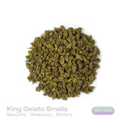 PUFFY King Gelato (smalls) is an indica-dominant hybrid THCa strain created from the potent pairing of High Octane and Curelato. The aroma presents a bold, fuel-like gasoline note, layered with sharp chemical undertones and rounded out by a smooth, rich buttery scent for a complex and striking fragrance. Visually, the dense buds showcase deep forest greens with dark accents, bright orange pistils, and a thick layer of sparkling trichomes. Consumers often describe an invigorating yet soothing experience, whe