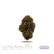 PUFFY LA Pop Rocks is a potent indica-dominant hybrid THCa strain crafted from the flavorful cross of Triangle Kush BX2 and Z Animal. The aroma is a captivating mix of sweet and fruity tones, layered with a strong gassy kick that gives it a bold and memorable presence. The flavor profile mirrors this with a sweet and sour apple candy taste, complemented by subtle notes of spicy black pepper and nutty mint. Visually, the buds are long and pepper-shaped with a minty green hue, thick orange pistils, and a gene