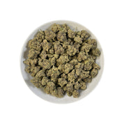 PUFFY Lazer Fuel is a powerful hybrid THCa strain, expertly crafted from the cross of Gary Payton and Falcon 9. The aroma is a complex and striking blend of zesty lemon peels, sharp chemical undertones, warm spices, and earthy notes of tar. Visually dense and fluffy, this pepper-shaped bud features forest green hues, bright orange pistils, and a thick, frosty coating of chunky white trichomes that make it truly unique. Consumers often report an immediate cerebral uplift that sparks creativity and sociabilit