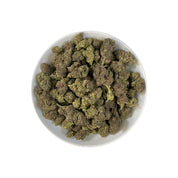 PUFFY Purple Glue is an indica-dominant hybrid THCa strain, crafted from the legendary cross of Purple Kush and Gorilla Glue #4 (GG4). The aroma is rich and inviting, combining smooth creamy notes with a warm, buttery finish for a decadent profile. Visually, the buds are dense and resinous with green and purple tones, bright orange pistils, and a frosty trichome finish. Consumers describe a high that opens with a burst of euphoria and mental lift before melting into a soothing full-body calm, making it a fa