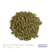 PUFFY Sherb Cream Pie (smalls) is an indica-dominant hybrid THCa strain, born from the renowned cross of Ice Cream Cake and Sherb BX1. The aroma bursts with sharp gas and pungent diesel, balanced by a zesty twist of fresh lemons. Visually, the buds are light and airy with a slightly conical form, showcasing rich green and purple tones, all enveloped in a sparkling layer of frosty trichomes. Consumers often report a wave of euphoria and happiness paired with soothing relaxation and a balanced mental uplift.
