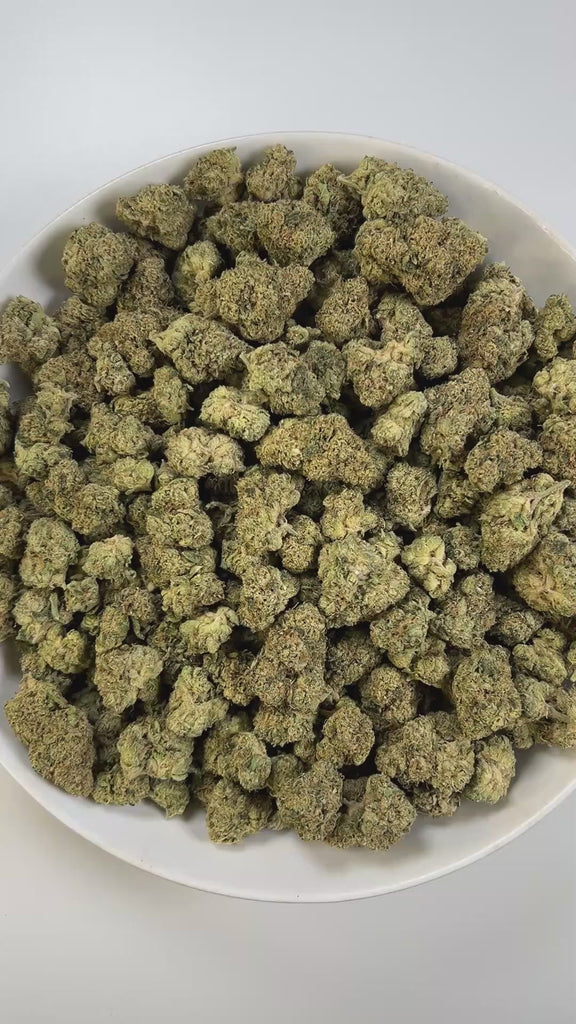 PUFFY Cherry Cookies is an indica-dominant hybrid THCa strain, created by crossing Cherry Pie and Girl Scout Cookies (GSC). The aroma combines the sweet scent of ripe cherries with a rich creamy layer and a sharp gassy kick. Visually, the buds are tightly packed and resinous, showcasing deep green tones with vibrant orange pistils and occasional hints of purple. Consumers often report a balanced experience that begins with happiness, euphoria, and mental clarity, eventually easing into soothing physical rel