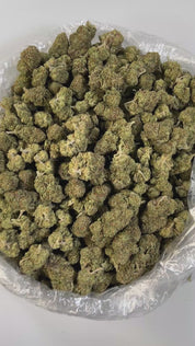 PUFFY Super Dope is a well-balanced hybrid THCa strain, born from a flavorful cross between ZKZ and Grape Pie. Its aroma bursts with sweet herbal notes, perfectly complemented by subtle hints of sugary candy, creating a soothing yet playful scent profile. Visually, the buds are strikingly dense, frosty, and generously coated in trichomes, showcasing deep purple hues, dark green leaves, and vibrant orange pistils. Consumers often describe its effects as a euphoric and uplifting cerebral high that sparks crea