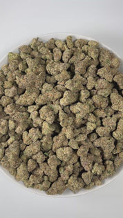 PUFFY Blueberry Headband is an indica-dominant hybrid THCa strain, crafted from the legendary lineage of  Blueberry × Headband. The aroma bursts with sharp citrus notes, balanced by bold diesel accents and grounded with fresh pine undertones, creating a bright yet earthy scent profile. Visually, the buds are dense and green, adorned with bright orange pistils and coated in a thick, frosty layer of glistening trichomes. Consumers often report a euphoric, happy, and relaxed high, an experience that combines a