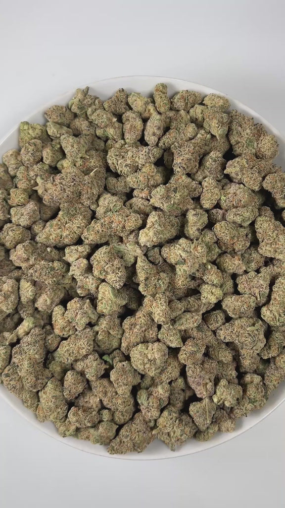 PUFFY Blueberry Headband is an indica-dominant hybrid THCa strain, crafted from the legendary lineage of  Blueberry × Headband. The aroma bursts with sharp citrus notes, balanced by bold diesel accents and grounded with fresh pine undertones, creating a bright yet earthy scent profile. Visually, the buds are dense and green, adorned with bright orange pistils and coated in a thick, frosty layer of glistening trichomes. Consumers often report a euphoric, happy, and relaxed high, an experience that combines a