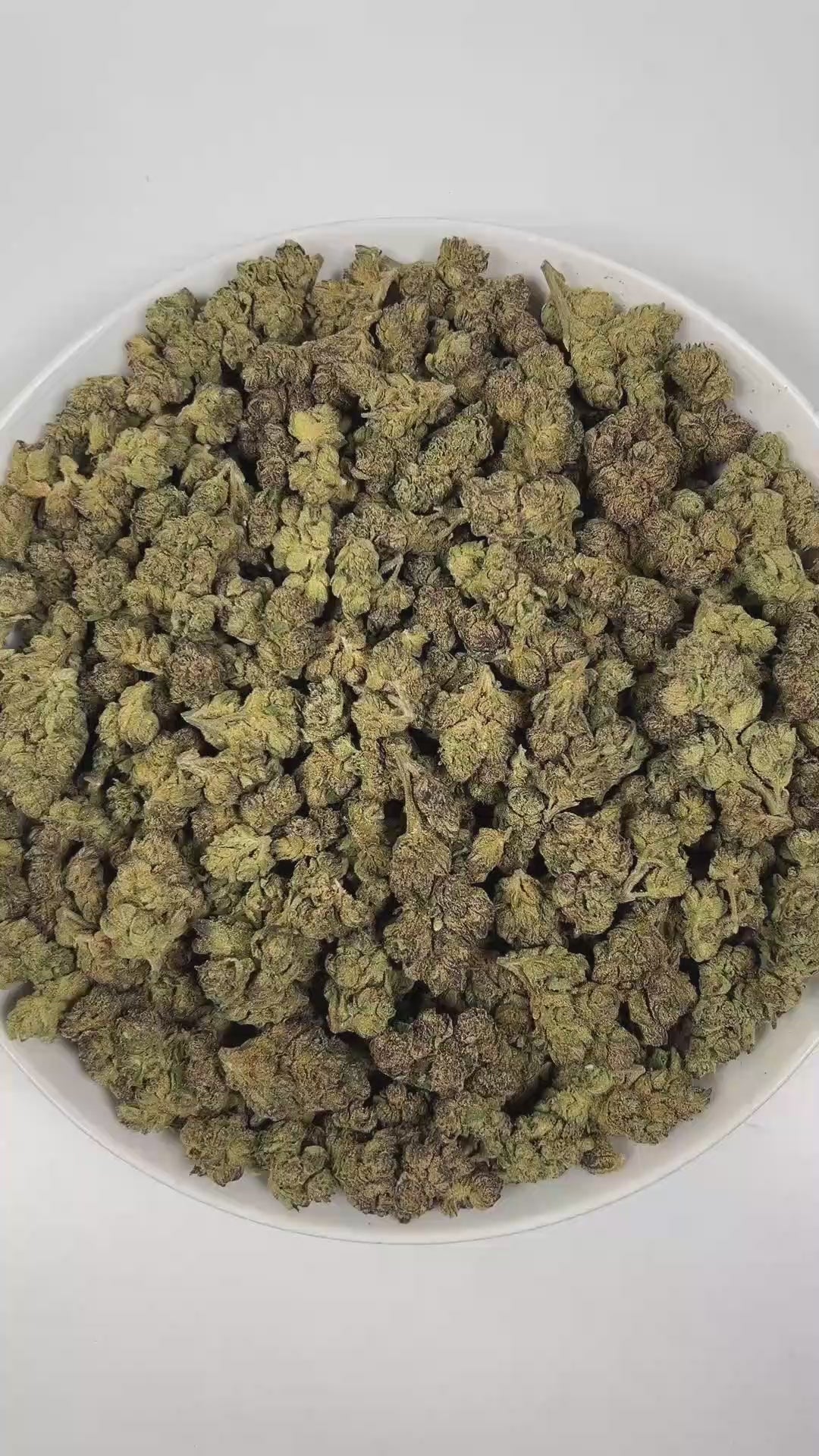 PUFFY Russian Assassin is an indica-dominant hybrid THCa strain, expertly crafted from the renowned genetics of Skywalker, Lemon OG Kush, and Headband. The aroma is a complex blend of herbal notes, pungent gassy undertones, and delicate floral hints, creating a distinctive and intriguing scent profile. Visually, dense green buds with purple hues and fiery orange pistils are coated in sticky trichomes. Consumers often report euphoric and happy feelings, cerebral stimulation that transitions into deep relaxat