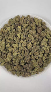 PUFFY Russian Assassin is an indica-dominant hybrid THCa strain, expertly crafted from the renowned genetics of Skywalker, Lemon OG Kush, and Headband. The aroma is a complex blend of herbal notes, pungent gassy undertones, and delicate floral hints, creating a distinctive and intriguing scent profile. Visually, dense green buds with purple hues and fiery orange pistils are coated in sticky trichomes. Consumers often report euphoric and happy feelings, cerebral stimulation that transitions into deep relaxat