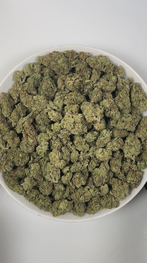 PUFFY Blue Dream is a sativa-dominant hybrid THCa strain born from the legendary cross between Blueberry and Haze. The aroma bursts with sweet berry notes, tangy sourness, and a distinctive gassy undertone for a bold, mouthwatering profile. Visually stunning, its dense, bright green buds are accented by deep blue hues, fiery orange pistils, and a generous dusting of icy trichomes making it as eye-catching as it is effective. Consumers often report a euphoric, uplifting head high that flows into a gentle, mo