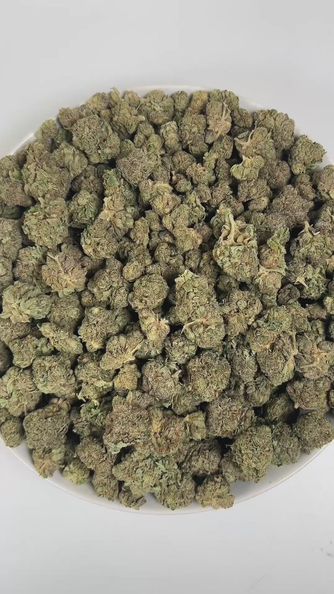 PUFFY Bubba Kush is an indica-dominant hybrid THCa strain, crafted from the legendary lineage of OG Kush × Afghani Indica. An enticing aroma of freshly brewed coffee, intertwined with subtle herbal tones, and softened by a smooth, creamy warmth. Visually striking, the buds are dense and resin-packed, shimmering with frosty trichomes over deep green and purple hues accented by bright orange hairs. Consumers often describe the effects as a wave of full-body relaxation that eases stress and pain, encourages re