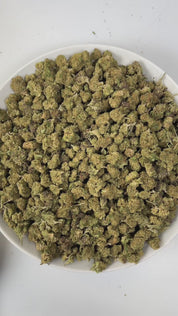 PUFFY Super Sour Nimbus (smalls) is an indica-dominant  hybrid THCa strain, expertly crafted from a potent cross between Super Silver Haze and Sour Diesel. The aroma is a bold fusion of sharp chemicals, zesty citrus, and pungent diesel, creating a striking and unforgettable scent profile. Visually, the buds are dense, featuring green and purple hues, vibrant orange pistils, and a sparkling layer of trichomes. Consumers often report a euphoric, relaxed body high accompanied by improved mood, a sense of happi