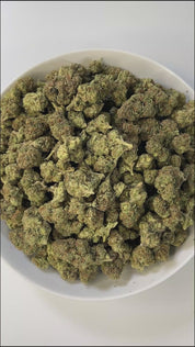 PUFFY Apple Smackz is a sativa-dominant THCa strain, expertly crafted from a flavorful cross between Apple Jack and Grape Pie. The aroma is earthy, musky, and woody, with a rich, natural scent that evokes the feeling of walking through a dense forest surrounded by damp soil and aged wood. Visually, the buds are vibrant lime green with a compact, tapered structure, featuring vivid orange pistils and a frosty layer of white-blue trichomes. Consumers often describe feeling uplifted and clear-headed, with a cal