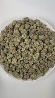 PUFFY Gary's Cherries is a well-balanced hybrid THCa strain, born from the exquisite cross of Cherry Fritter and Gary Payton. The aroma is a zesty fusion of tangy lime, sweet candy, and pungent gassy notes, creating a vibrant and irresistible scent. Visually, the dense buds display forest green and purple hues, highlighted by orange pistils and a sparkling layer of trichomes. Consumers often report a balanced high that begins with an uplifting, clear-headed euphoria, followed by gentle relaxation, making it