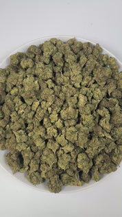 PUFFY Blue Nerdz is a balanced hybrid THCa strain, born from the fusion of Forbidden Fruit and Watermelon Z. The aroma bursts with sweet candy notes intertwined with ripe berries and a fresh piney finish, offering a delightful blend of fruity and forest-like scents. Visually, it features compact, bulbous buds in green and deep purple hues, highlighted by orange pistils and a thick frost of trichomes. Consumers often report an initial cerebral uplift characterized by euphoria, elevated mood, and a burst of c