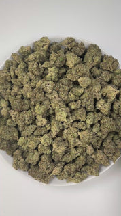 PUFFY Lava Cake is an indica-dominant hybrid THCa strain, crafted from the legendary lineage of Cross of Thin Mint × Grape Pie. The aroma is a rich blend of cookies, creamy vanilla, and a hint of dank sweetness, creating a warm and indulgent scent profile. Visually, the buds are dense with purple highlights, vibrant greens, and bright orange hairs, all dusted in frosty trichomes. Consumers often describe an initial wave of cerebral euphoria and light uplift before the experience shifts into deep physical ca