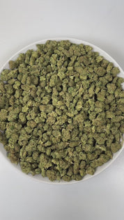 PUFFY Candy Rain (smalls) is an indica-dominant hybrid THCa strain, crafted from the flavorful cross of London Pound Cake × Gelato. The aroma is a bold and playful blend of sweet candy, tangy sour notes, and rich, dank undertones, creating a vibrant and memorable scent profile. Visually, dense green buds with purple hues and fiery orange pistils are coated in sticky trichomes. Consumers often report experiencing a happy and euphoric mood, accompanied by relaxed, calm body sensations and uplifted, giggly fee