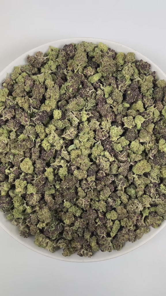 PUFFY Double Stuffed (smalls) is an indica-dominant  hybrid THCa strain, born from the unique pairing of Platinum White and Cookies and Cream. The aroma is a vibrant blend of citrus, funky undertones, and subtle chemical notes, creating a distinctive and memorable scent profile. Visually, dense green buds with hints of purple, bright orange pistils, and a thick coating of sparkling trichomes. Consumers often report a euphoric, uplifting head high that settles into calming physical relaxation, resulting in a