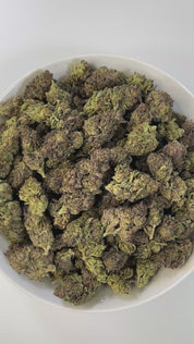PUFFY Gusher Cream is a potent indica-dominant hybrid THCa strain crafted from the flavorful fusion of Gelato #41 and the legendary Triangle Kush. The aroma is a delightful fusion of creamy richness, sweet cake, and a burst of juicy freshness. Visually, the buds are dense and resinous, with rich green and purple hues, fiery orange pistils, and a heavy dusting of frosty white trichomes. Consumers often report a sparkling cerebral rush that uplifts the mood and enhances mental clarity, followed by a gentle, f