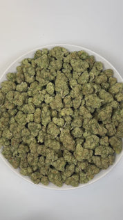 PUFFY Bluephoria is a balanced hybrid THCa strain, born from the renowned cross of Glitter Bomb × Good Greens Candy. The aroma is pungent and gassy, with bright bursts of berry and a zesty lime twist. Visually, dense deep green buds with purple hues and fiery orange pistils are coated in sticky trichomes. Consumers often report an invigorating mental lift that fuels creativity and social moments, while a smooth, relaxing body buzz melts away tension.