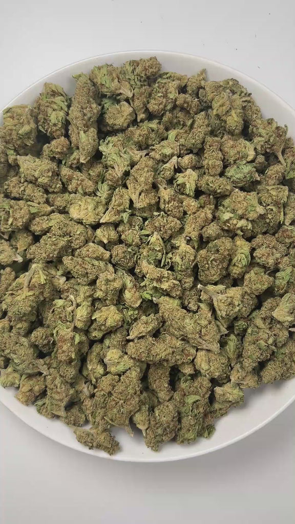 PUFFY Gucci Fruit is a sativa-dominant hybrid THCa strain, expertly crafted by crossing the legendary Grim Bastard OG and Forbidden Fruit. The aroma bursts with sharp notes of pine and diesel, layered with a bold chemical edge that gives it a distinctly powerful, fuel-like punch, perfect for those who love intense, invigorating scents. Visually, dense neon-green buds with pink undertones, fiery orange pistils, and a frosty coat of shimmering trichomes. Consumers often report an initial head lift that brings
