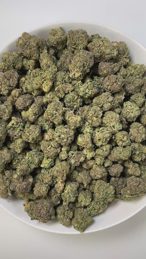 PUFFY Bubba Kush is an indica-dominant hybrid THCa strain, crafted from the legendary lineage of OG Kush × Afghani Indica. The aroma carries deep earthy tones layered with warm cedar and a subtle kick of spice. Visually striking, the buds are dense and resin-packed, shimmering with frosty trichomes over deep green and purple hues accented by bright orange hairs. Consumers often describe the effects as a wave of full-body relaxation that eases stress and pain, encourages restful sleep, and sparks a welcome b
