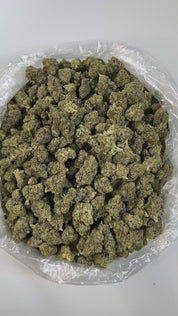 PUFFY Ice Queen is a sativa-dominant hybrid THCa strain, born from the legendary pairing of White Widow and Cinderella 99. Aroma is creamy and smooth, layered with bright tropical fruit notes and a sweet candy-like finish, evoking the scent of a tropical dessert with a luscious, indulgent twist. The flavor is equally rich, creamy and smooth with a velvety mouthfeel. Visually, the buds are light and fluffy with rounded clusters, dark olive-green hues, neon highlights, and a heavy coat of frosty white trichom