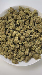 PUFFY Shake Shack is a balanced hybrid THCa strain, born from the flavorful cross of Ice Cream Cake × OG Fruit Smoothie. The aroma combines sharp diesel notes with a cool, minty freshness and a strong gassy undertone. Visually, the buds are dense and chunky, showing forest-green tones with frosty trichomes and subtle orange-amber pistils for contrast. Consumers often describe a soothing full-body relaxation paired with a calm, clear mind, while others note uplifting effects that boost mood, spark euphoria, 