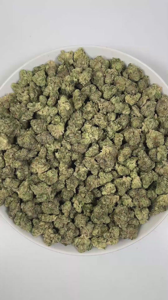 PUFFY Tiger Mintz is an indica-dominant hybrid THCa strain, crafted from the masterful cross of Orange Push Pop × Animal Mintz. The aroma is sweet and inviting, with refreshing minty notes and a hint of juicy berry that lingers pleasantly. Visually, dense green buds with purple hues and fiery orange pistils are coated in sticky trichomes. Consumers often report experiencing deep relaxation and body calm, euphoric mood uplift, and a heightened sense of creativity or focus.