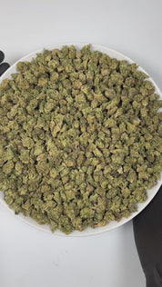 PUFFY Obama Twist (smalls) is a balanced hybrid THCa strain, born from the bold and flavorful cross of Lemon Tree × Obama Kush. The aroma opens with a sharp, tangy lime zest, layered over rich woody notes and underscored by a bold, diesel undertone. Visually, the buds are dense and striking, with vibrant green and purple tones, bright orange pistils, and a frosty coating of trichomes. Consumers often report an uplifting, creativity-boosting high paired with a perfectly balanced sense of relaxation that invi