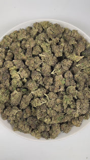 PUFFY Velato is a balanced hybrid THCa strain, originating from the fusion of Gelato 33 with VS1. The aroma is a captivating blend of gassy, herbal, and spicy notes, creating a rich and intriguing scent profile. Visually, the buds are compact and frosty, showcasing green and purple hues with bright orange pistils and a thick coating of sparkling trichomes. Consumers often report feeling deeply relaxed, uplifted with a sense of happiness, and wrapped in a warm wave of euphoric bliss that gently elevates both