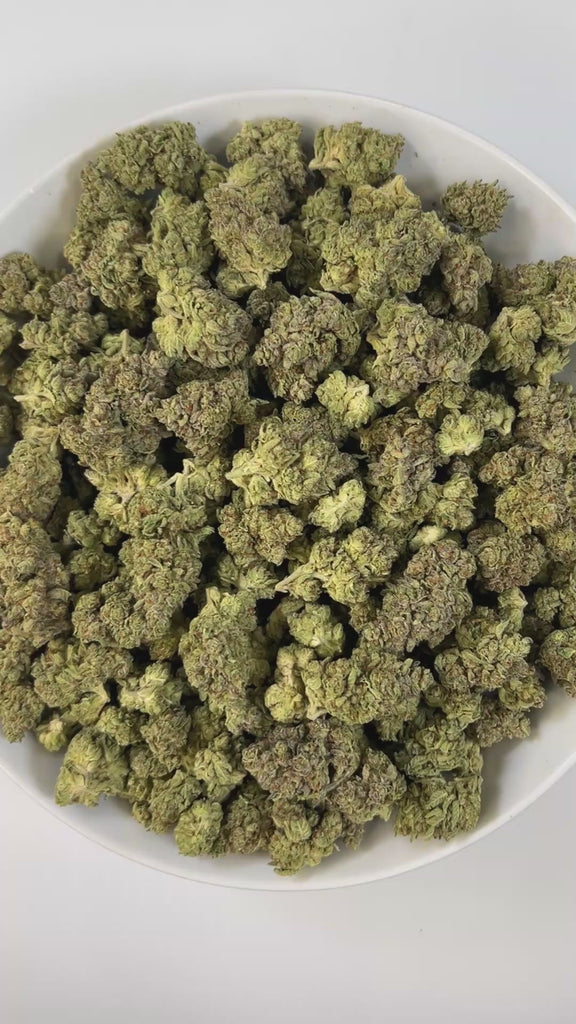 PUFFY Dough Boy is an indica-dominant hybrid THCa strain, crafted from the legendary lineage of Cinderella 99 with a hybrid of Northern Lights × Durban.  The aroma carries a rich blend of fresh-baked dough and sweet cake, rounded out by smooth, creamy undertones for a warm and indulgent profile.  Visually, the buds are dense, with vibrant lime-green hues, fiery orange pistils, and a frosty blanket of trichomes. Consumers often report a balanced high that begins with euphoric uplift and creativity before mel