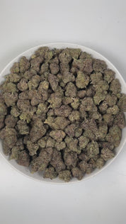 PUFFY Blue Runtz  is an indica-dominant hybrid THCa strain, born from the renowned pairing of Blueberry and White Runtz. The aroma opens with luscious ripe cherry notes, beautifully layered with delicate floral undertones and a smooth, candy-like sweetness that creates an inviting and elegant sensory experience. Visually, dense green buds with purple accents and fiery orange pistils are coated in sticky, glistening trichomes. Consumers often report a balanced experience of uplifting euphoria and mental clar