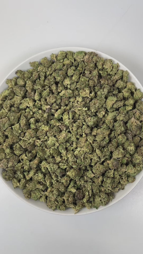 PUFFY Pink Guava (smalls) is a balanced hybrid THCa strain, created by crossing Nepali Pink and Guava. The aroma is a captivating blend of juicy guava, earthy undertones, and delicate hints of violet, creating a rich and intriguing fragrance that is both fruity and floral with a grounding depth. Visually, dense pine green buds with purple hues and fiery orange pistils are coated in sticky trichomes. Consumers often report experiencing euphoria, happiness, relaxation, and enhanced focus, enjoying a balanced 