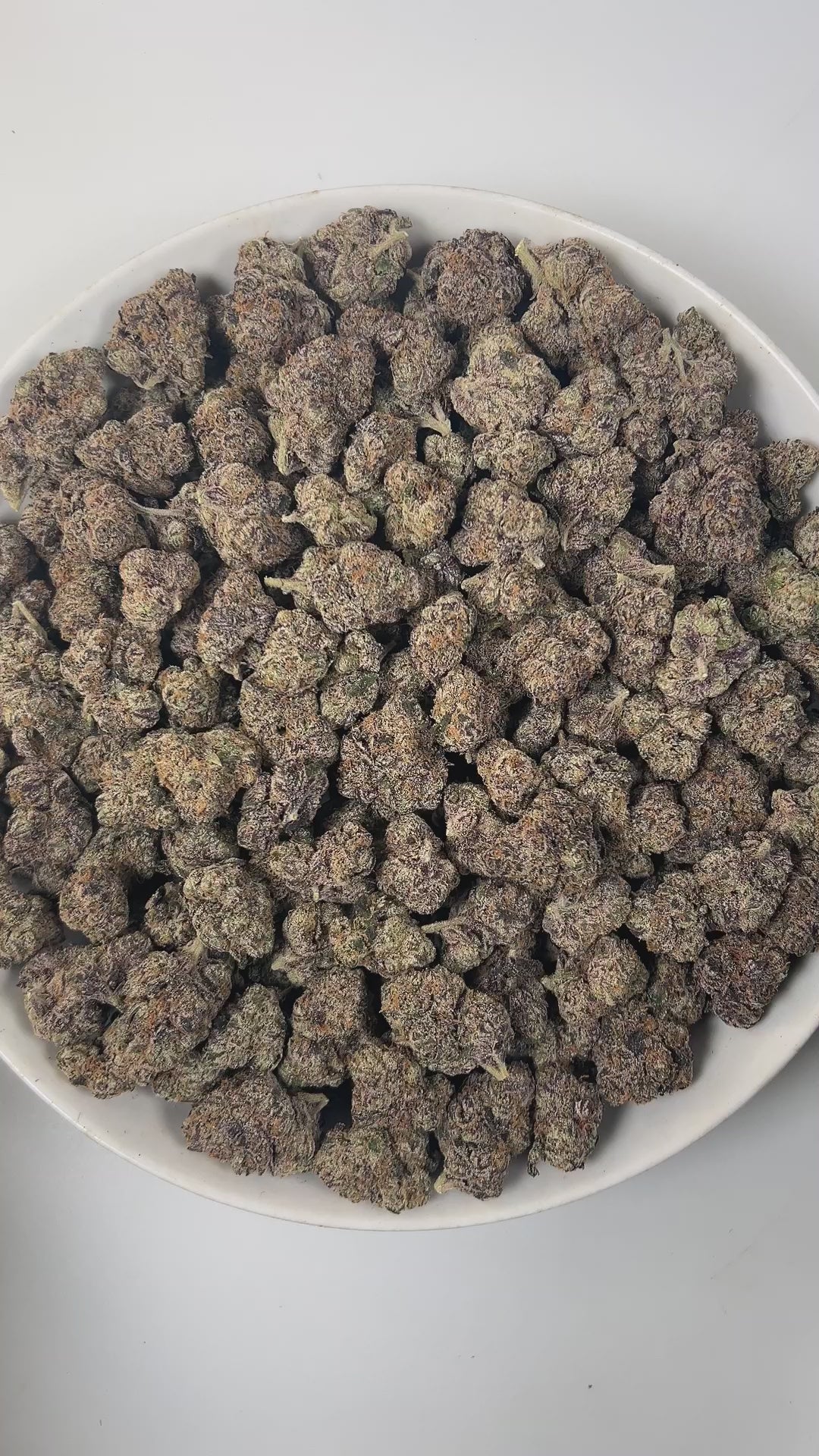 PUFFY Laffy Taffy is a sativa-dominant hybrid THCa strain, born from the flavorful cross of Banana OG and Pestilence. The aroma is a delightful blend of sweet candy, juicy berries, and subtle earthy undertones. Visually, the buds are dense and striking, showcasing deep green and rich purple hues, accented by bright orange pistils and a sparkling layer of trichomes. Consumers often report an uplifting and euphoric high that brings happiness, energy, and mental clarity, fostering creativity and focus, while g