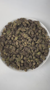 PUFFY Purple Candy is an indica-dominant hybrid THCa strain, expertly crafted from a premium cross of BC Sweet Tooth and Mendocino Purps. The aroma bursts with sweet grape and candy notes, grounded by a rich, earthy undertone that captivates the senses. Visually, dense green buds with purple hues and fiery orange pistils are coated in sticky trichomes. Consumers often report a deep sense of relaxation and calm, paired with happiness and euphoria, a soothing body buzz, and a noticeable boost in appetite.
