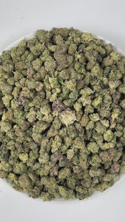 PUFFY Bubblegum Gelato (smalls) is an indica-dominant hybrid THCa strain, was crafted by crossing the flavorful Gelato #45 with the classic Indiana Bubblegum. The aroma is a bold fusion of sweet cherry layered with earthy undertones and a subtle hint of rubber, creating a uniquely rich and intriguing scent profile. Visually, the buds are dense and compact, showcasing deep forest-green hues accented by long, fiery orange pistils and a generous coating of glistening trichomes. Consumers often report an uplift