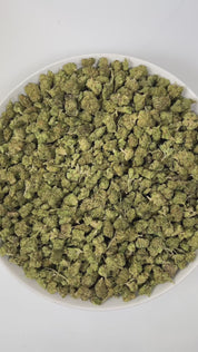 PUFFY Charlotte’s Web (smalls) is a sativa-dominant hybrid THCa strain. The exact parent genetics were never disclosed, but it is believed to have been bred from high-CBD hemp with extremely low THC levels. The aroma is a delightful blend of sweet strawberry, smooth cream, and a bold hint of diesel, creating a rich and enticing fragrance experience. Visually, the dense buds display green tones with deep purple hues, vibrant orange pistils, and a frosty trichome coating. Consumers often report feeling euphor