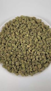 PUFFY Almond Mochi (smalls) is a balanced hybrid THCa strain, crafted from the flavorful cross of Mochi and Biscotti Dough. The aroma is a bold and intriguing blend of diesel, nutty undertones, and a subtle hint of vanilla, creating a rich and inviting scent profile. Visually, dense deep green buds with hints of purple are threaded with fiery orange pistils and coated in a sparkling layer of sticky trichomes. Consumers often report a balanced high combining happy, creative, and euphoric effects with calming