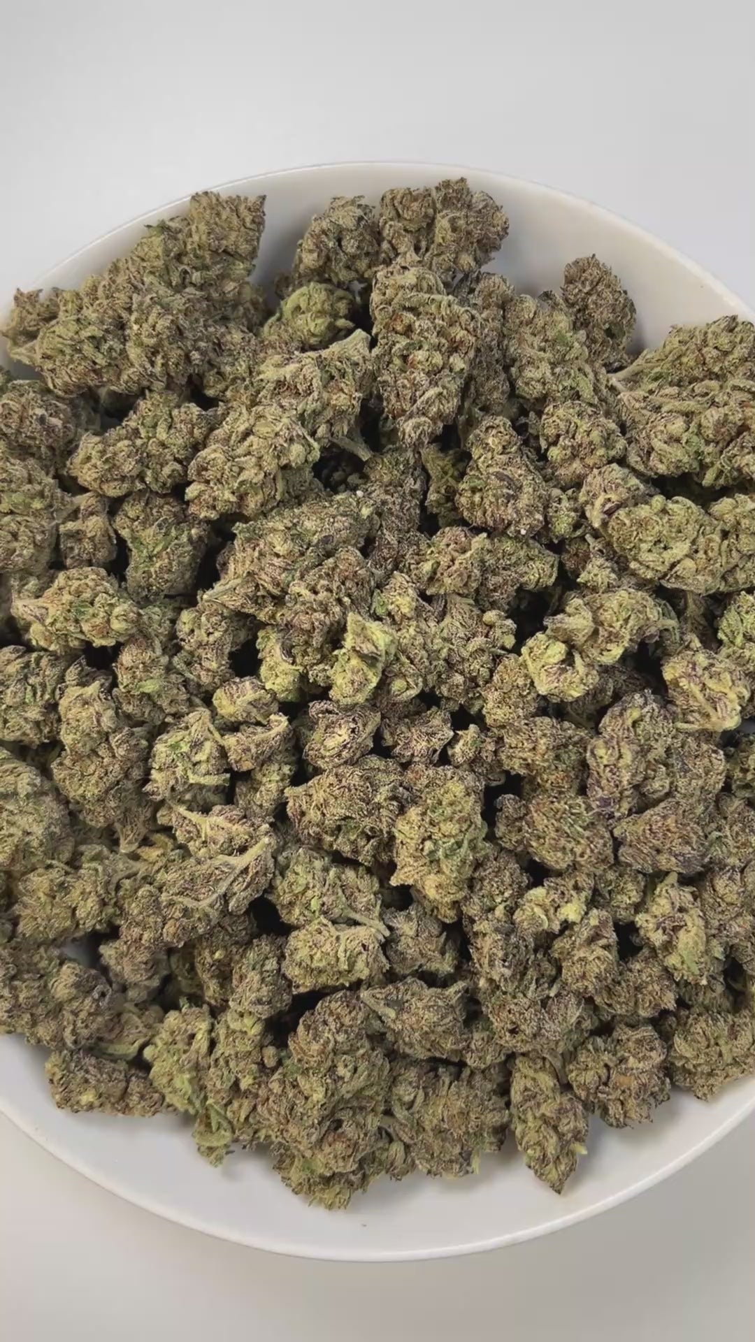 PUFFY Pink Certz is a balanced hybrid THCa strain, created from the potent pairing of The Menthol and Grape Gasoline. The aroma combines sweet, candy-like notes with hints of juicy grape, layered over a sharp, earthy diesel scent. Visually, dense frosty buds glow neon green with golden hints and pink-orange hairs, coated in sparkling, gem-like trichomes. Consumers often experience an uplifting, clear-headed euphoria that sparks creativity and focus, followed by gentle body relaxation, making it ideal for mo