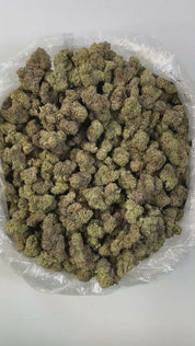 PUFFY Bubba Z is an indica-dominant hybrid THCa strain, born from a cross between OG Kush and an unknown Afghani landrace indica. It boasts a complex aroma profile with strong notes of gas, chemical undertones, and a hint of fruitiness. Visually, its chunky, spade-shaped buds feature deep olive-green hues accented by bright orange pistils and a thick, frosty coating of trichomes. Consumers often report that the effects build slowly, beginning with a gentle cerebral uplift and light giggles, which eventually