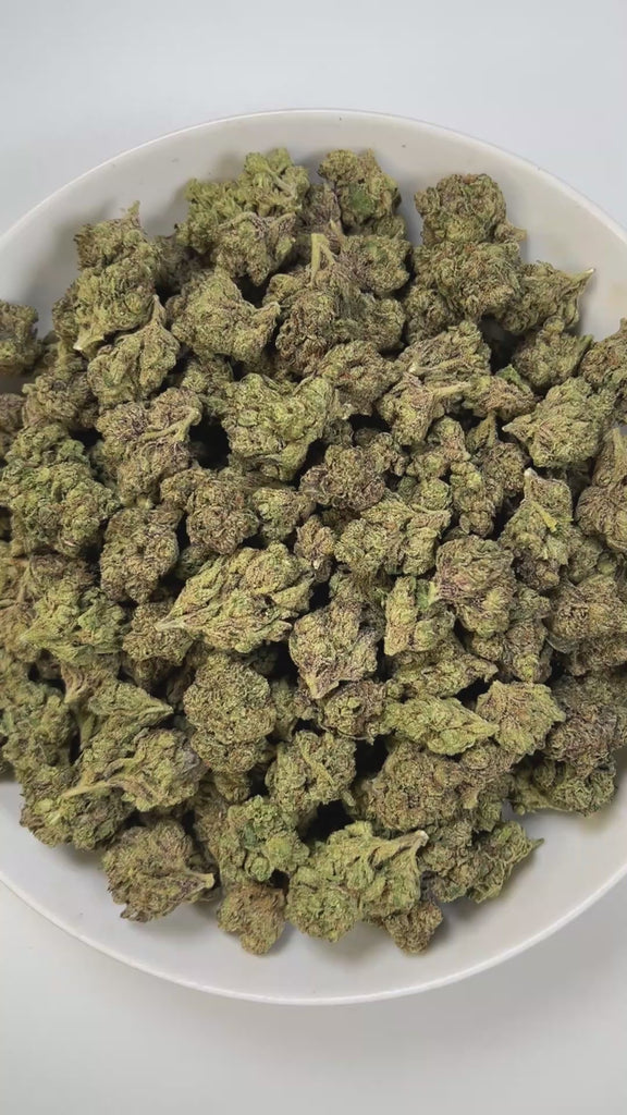 PUFFY Candy Gelato is a balanced hybrid THCa strain born from a complex cross of Blue Oreoz × Cotton Candy Gelato / Candyland × GG4 × Gelato. The aroma is a bold fusion of sweet candy notes, sharp gassy undertones, and a punch of chemical sharpness that creates a strikingly memorable profile. Visually, its dense, colorful nugs range from dark forest green to vibrant purple, often coated in a heavy layer of frosty trichomes. Consumers commonly report a fast-acting euphoric lift, delivering mental stimulation