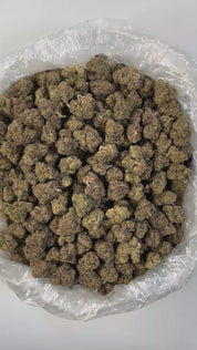 PUFFY Gello is a balanced hybrid THCa strain born from the flavorful cross of Bacio Gelato and Mochi Gelato. It delivers a sweet, fruity berry flavor layered with subtle notes of spicy pine and earthy undertones. The aroma mirrors the taste, blending earthy, floral, and skunky pine scents for a rich sensory experience. Visually, the buds are bright neon green with deep amber hues, vivid orange pistils, and a dense coating of chunky amber trichomes, making them as striking as they are potent. Consumers often