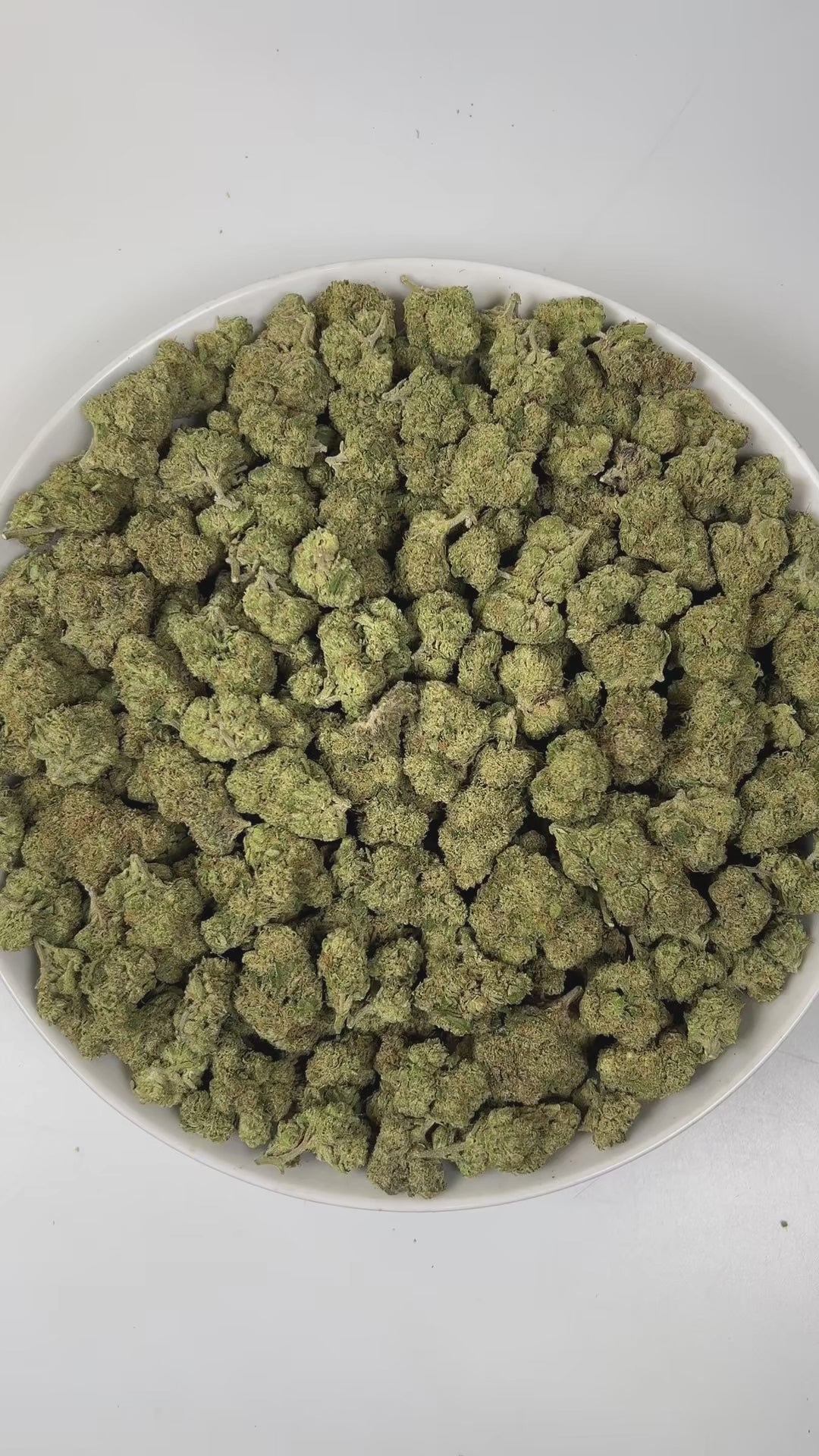 PUFFY Bubba Kush is an indica-dominant hybrid THCa strain, crafted from the legendary lineage of OG Kush × Afghani Indica. The aroma is a lively blend of sweet oranges and ripe berries, underlined by a distinct gassy note, creating a bright, tangy, and slightly pungent scent profile. Visually striking, the buds are dense and resin-packed, shimmering with frosty trichomes over deep green and purple hues accented by bright orange hairs. Consumers often describe the effects as a wave of full-body relaxation th