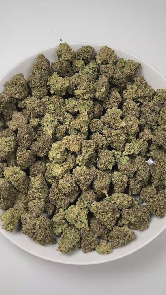 PUFFY Papaya is a premium hybrid THCa strain, created from a cross between Citral #13 and Ice #2. The aroma bursts with tropical vibrance, blending juicy apricot sweetness and refreshing melon undertones for a lush, island-inspired scent. Visually, this strain showcases dense, compact buds in shades of bright to deep lime green, heavily coated in white, milky trichomes that give it a frosty appearance. Consumers often describe the effects as euphoric and uplifting, with a gentle cerebral buzz that enhances 