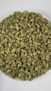 PUFFY GG4 (smalls) also known as Gorilla Glue #4 is a potent hybrid THCa strain, created from a cross between Chem’s Sister, Sour Dubb, and Chocolate Diesel. The aroma combines earthy notes with bright citrus accents and a hint of spice, creating a warm and invigorating scent profile. Visually, the buds are dense and chunky, showcasing a vibrant green color accented by fiery orange pistils. Consumers frequently report an intense euphoric high, marked by an uplifting mental buzz that promotes happiness, care