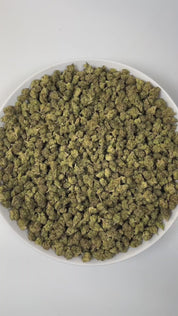 PUFFY Bolo Runtz (smalls) is an indica-dominant hybrid THCa strain, born from the legendary pairing of Gelato and ZKZ. The aroma is a captivating blend of sweet berries, pungent gassy notes, and rich earthy undertones. Visually, the buds are dense and vibrant, showcasing vivid green and deep purple hues, accented by bright orange pistils and a generous coating of sparkling trichomes. Consumers often report a balanced high that begins with a euphoric cerebral lift and gradually settles into a soothing body e